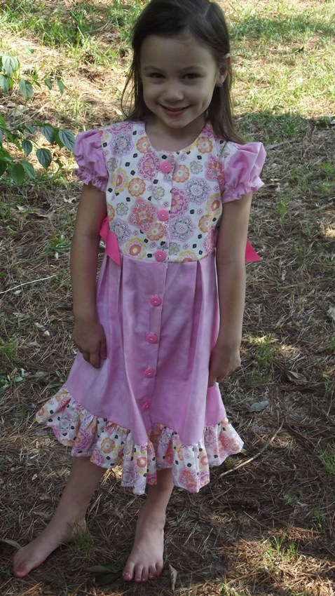 Girls Dress size 5, short sleeves, pleated skirt, side ribbon ties. button front